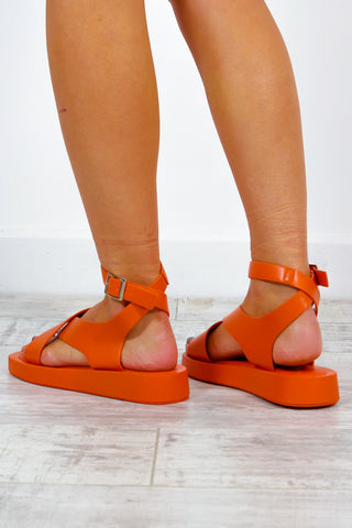 At A Crossroads - Orange Sandals